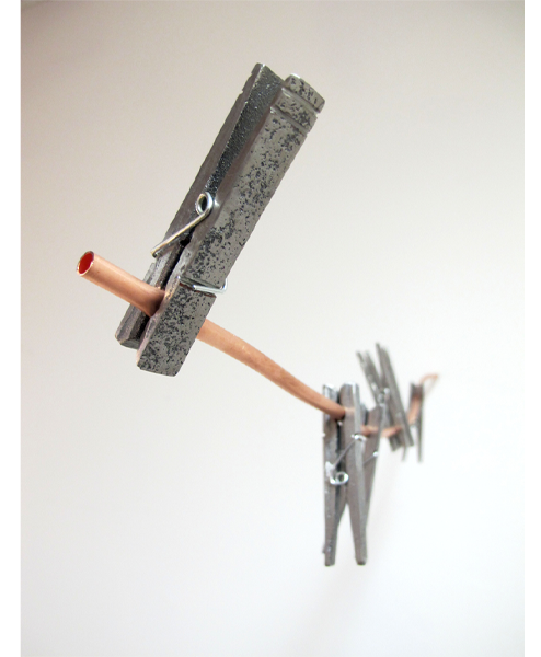 Artwork titled “Clothespins” by Erin Tucker. 