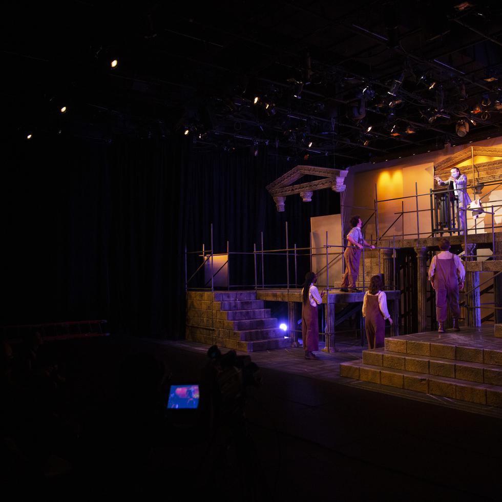 Students perform on stage during a production of “Julius Ceasar.” 