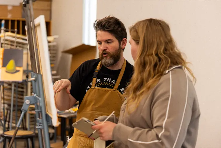 An instructor and student in the art department studio at SEMO a location for expeirenital learning opportunies