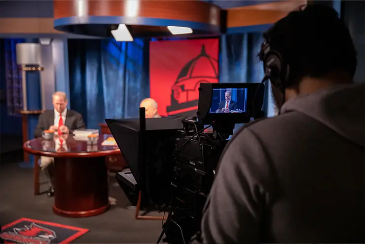 student behind the video camera on set for tv / film major experiential learning opportunities at SEMO