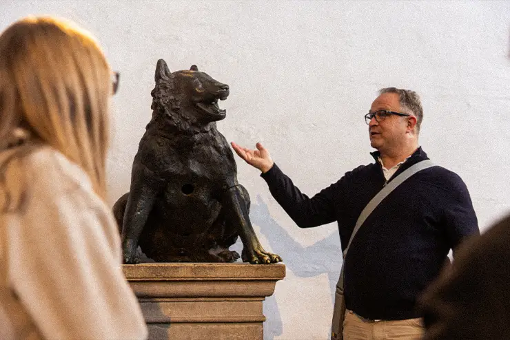 An instructor abroad teaching students about an art piece in Europe while studying at SEMO one of the best missouri colleges for experienital learning opportunites