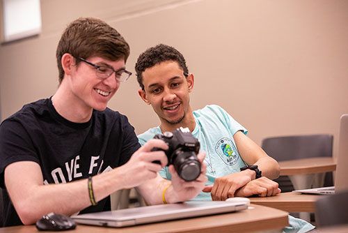 SE Creative students work in the main level of Rust Center for Media.