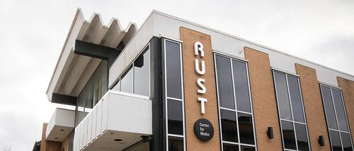 Rust Center for Media building in downtown Cape Girardeau with their logo on the side of the building.