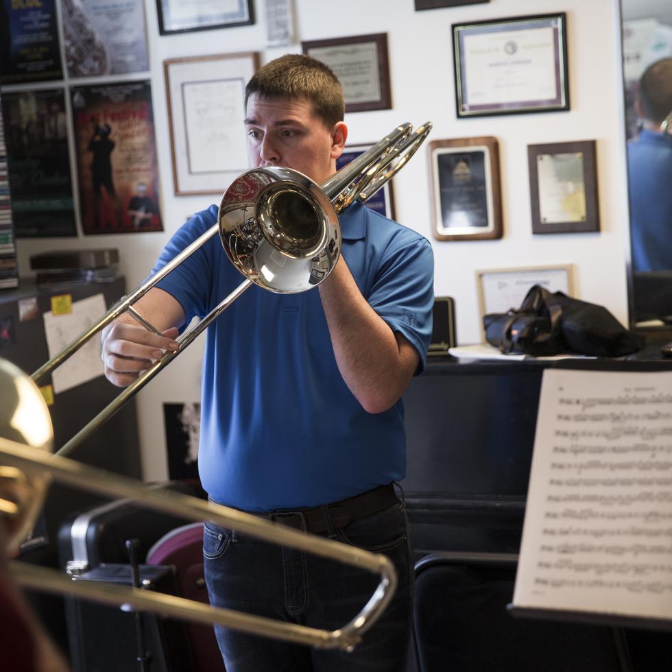Student practices the trombone