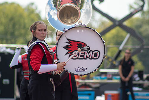  Student in Southeast’s marching band walking in parade  