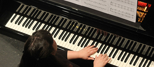  A student in the Symphony Orchestra plays the piano.  