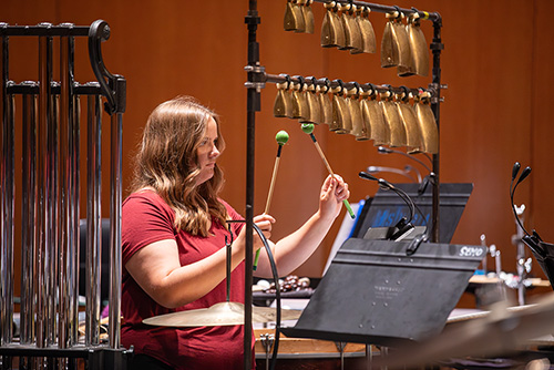 A close-up image of a SEMO student using a percussion instrument 