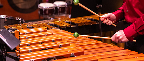 Someone plays the xylophone during percussion practice.