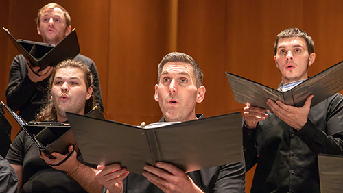 Four Semo students sing during a choir performance.