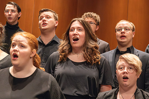   Several studenst sing during a performance in the Shuck Recital Hall.  