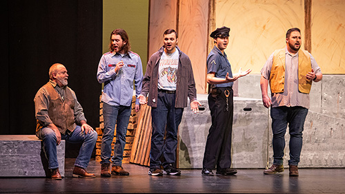 Semo students sing dressed as blue collar workers during a production of "Carmen"