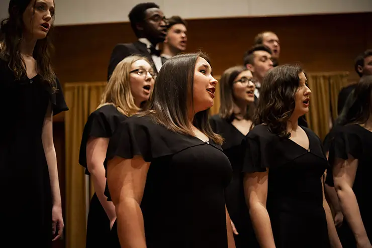 SEMO choir students dressed up for performance sing for an audience
