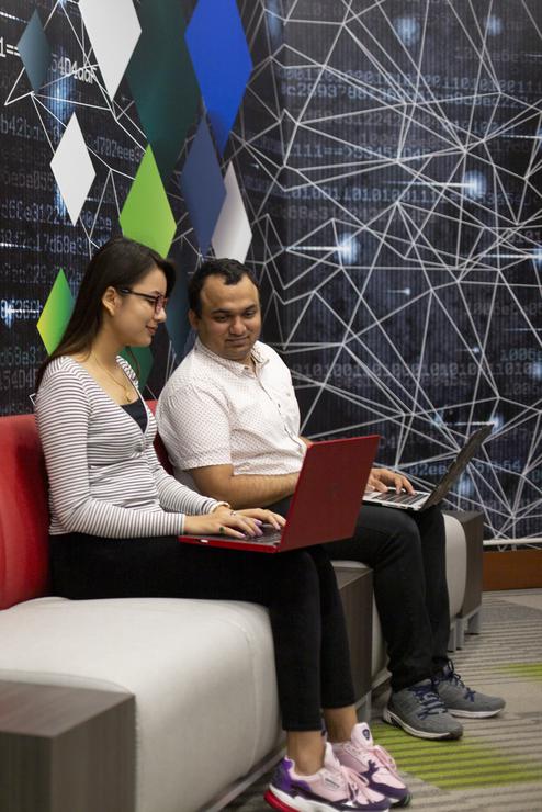 Students work on laptops in the Universitys Cyber Range.