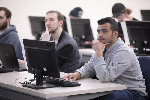 Students listen intently in class