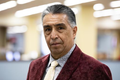 Dr. Mario Garcia looks at the camera for a portrait.