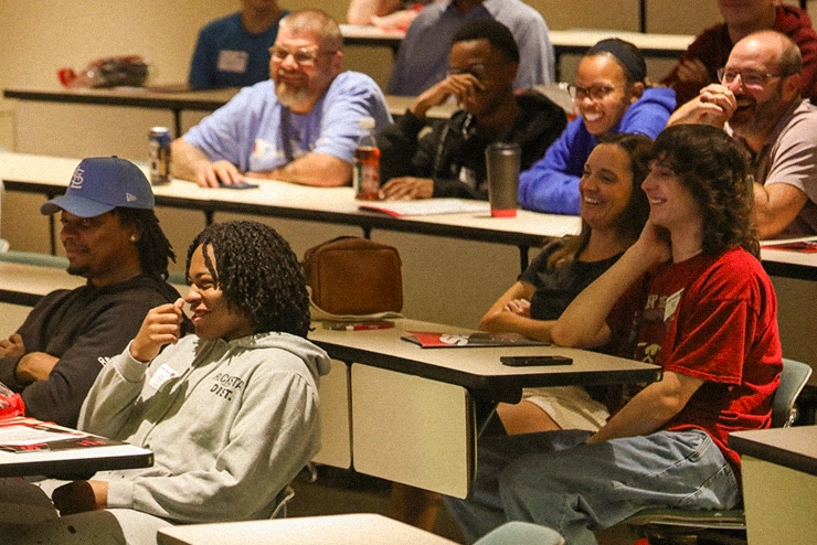 Community Members joining Southeast at a Community CyberSecurity training day to learn more about a safer online experience. They're smiling because online safety at SEMO is fun. 