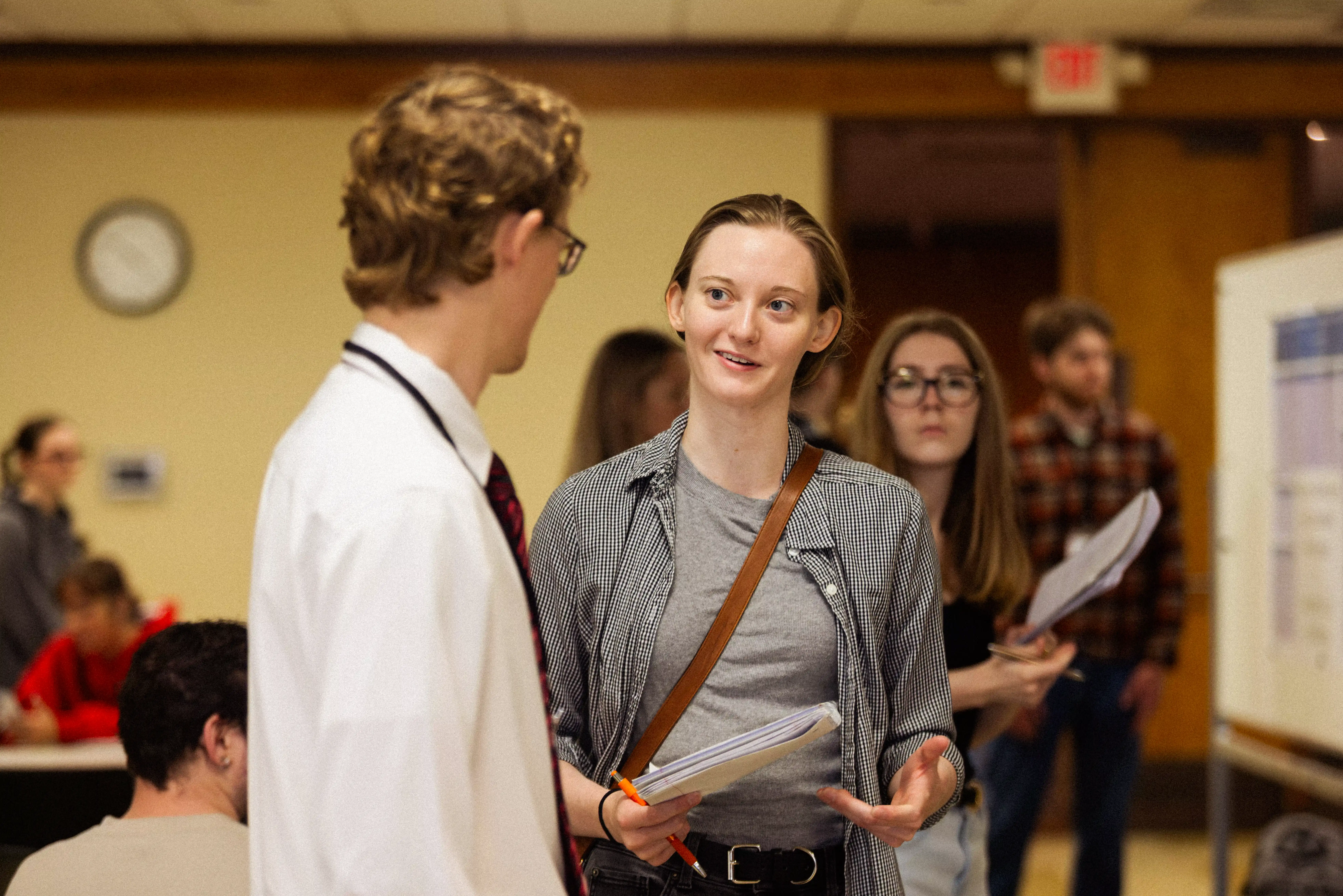 two management students networking at a research conference