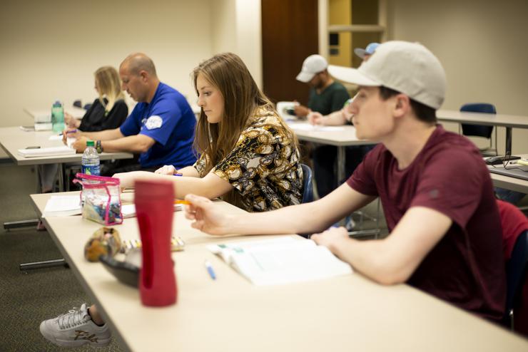 Students study in a business class at Dempster Hall. 