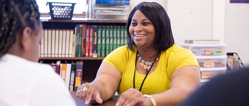 A SEMO alum smiles while teaching an exceptional child class at a Cape Girardeau school.