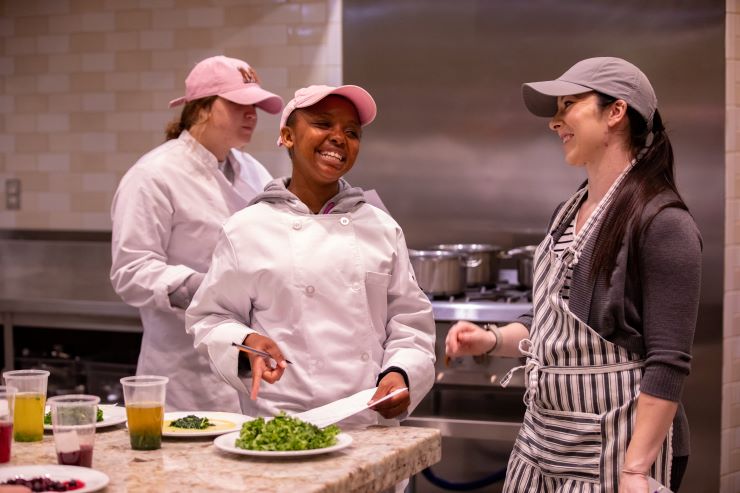Students practice food science in the kitchen.
