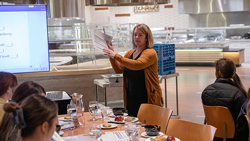 Nutritionist program students taste testing food.