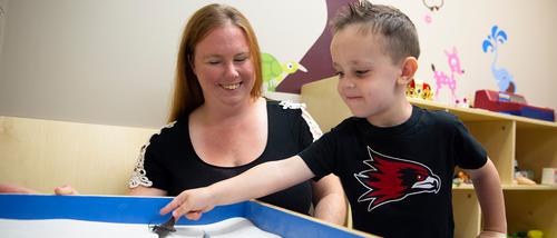 A Child and family Studies student works with a student at the Community Counseling Center.