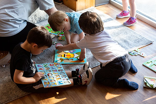A teacher at the University School for Young Children reads a book to their class.