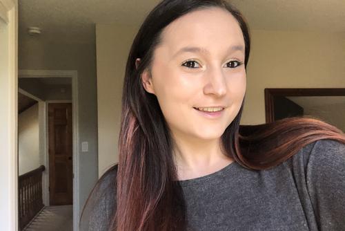 Selfie of Madison wearing a grey shirt.