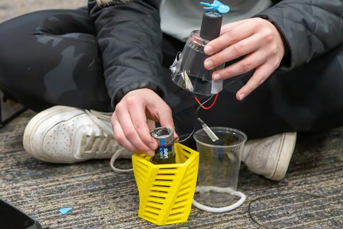 Students put together learning devices for communication disorder clients 