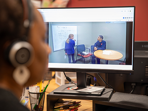 Student works on learning materials in the studio.