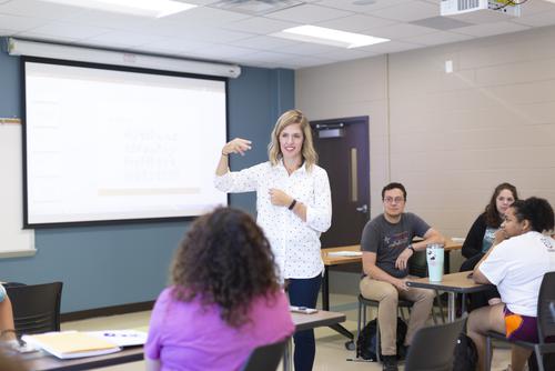 communication disorders majors in class receive instruction on sign language