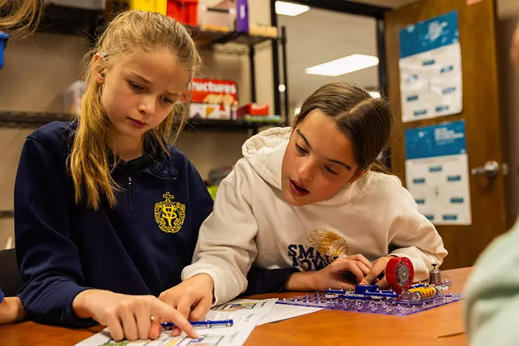 two middle school students play with the technology in the EDvolution Center