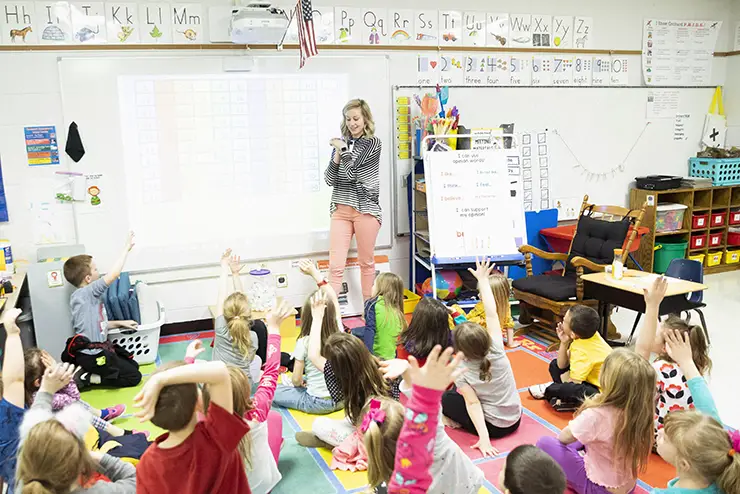a SEMO elementary education major stands at the front of a classroom full of elementary students
