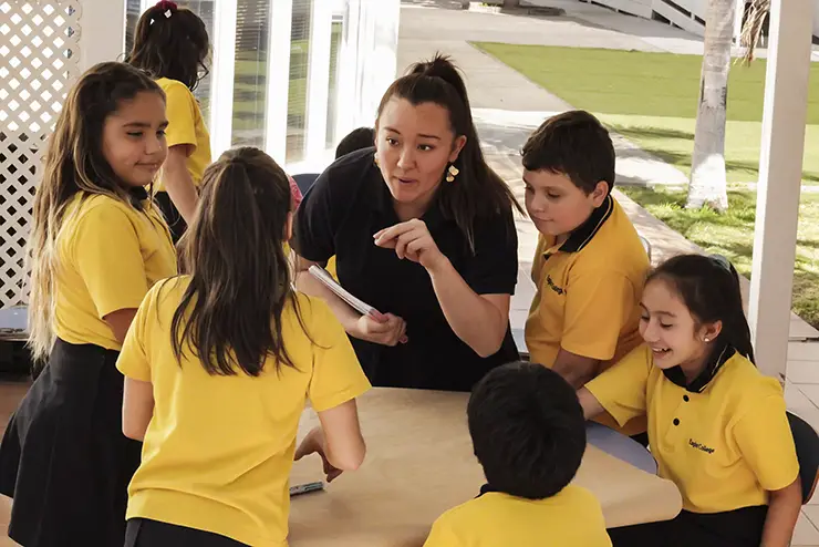 a SEMO student teacher teaching abroad in chile talks to a group of children during class