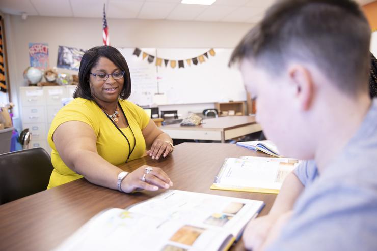 Bracole Mills, wearing a yellow shirt, teaches her exceptional child class at Cape Junior High. 