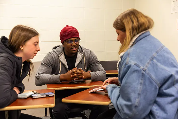 three Family Science students work together in a small group during a class project at semo a top Missouri school for experiential learning
