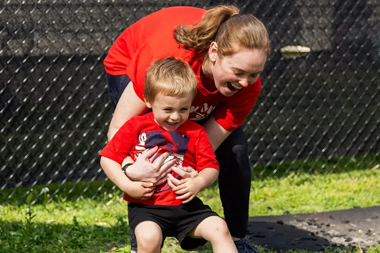 a human development and family science student plays with a young boy at the university school for young children at semo a top Missouri school for experiential learning