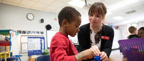 A Southeast student interacts during an activity with a student at Jefferson Elementary during their student teaching assignment.