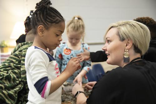 A Jefferson Elementary student talks to the Southeast student teacher.  
