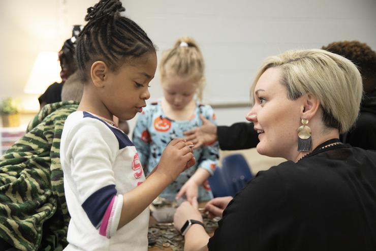 A Jefferson Elementary student talks to the Southeast student teacher.  