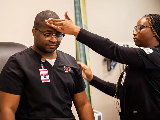 Brodrick, SEMO nursing student, sits for an exam from a fellow student