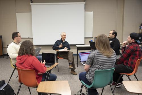 A group of missouri psychology students have a discussion during class.