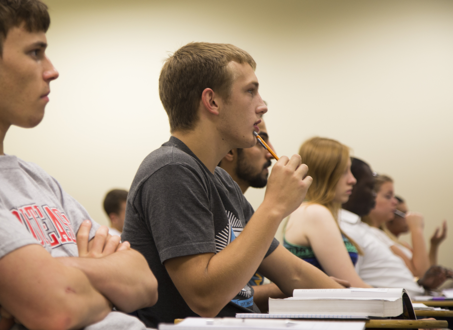 Philosophy majors listen and take notes during an Ethics lection.