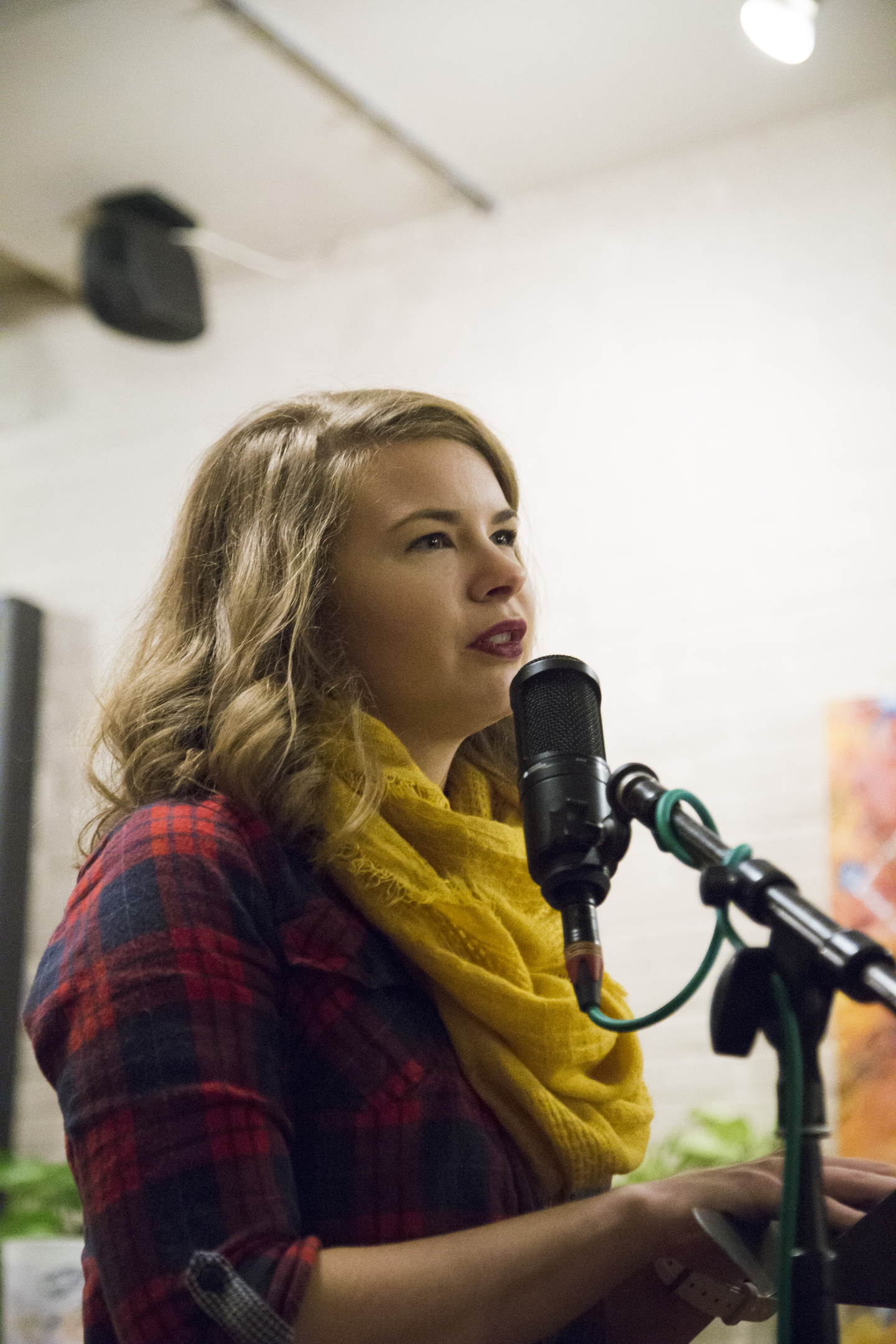 An English major reads at a local coffee shop’s open mic night.