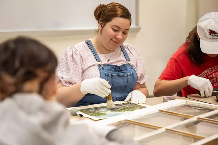 a history student works on a preservation project in class at semo a Missouri college known for job readiness