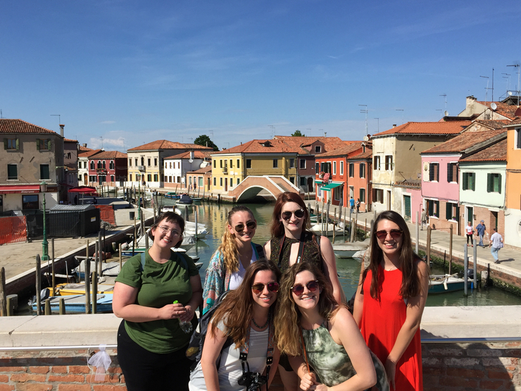 While studying abroad, a group of students a group picture.
