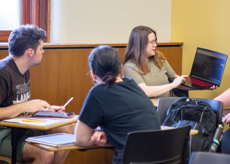 Students working together during writing.