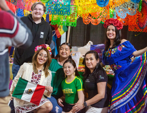 Students wearing traditional cultural attire celebrate Carpe Diem