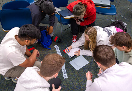 Southeast Students work in a group on a set of problems.