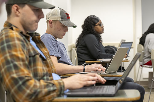 Group of Sociology Students working together on directed research which provides Experiential Learning in Sociology